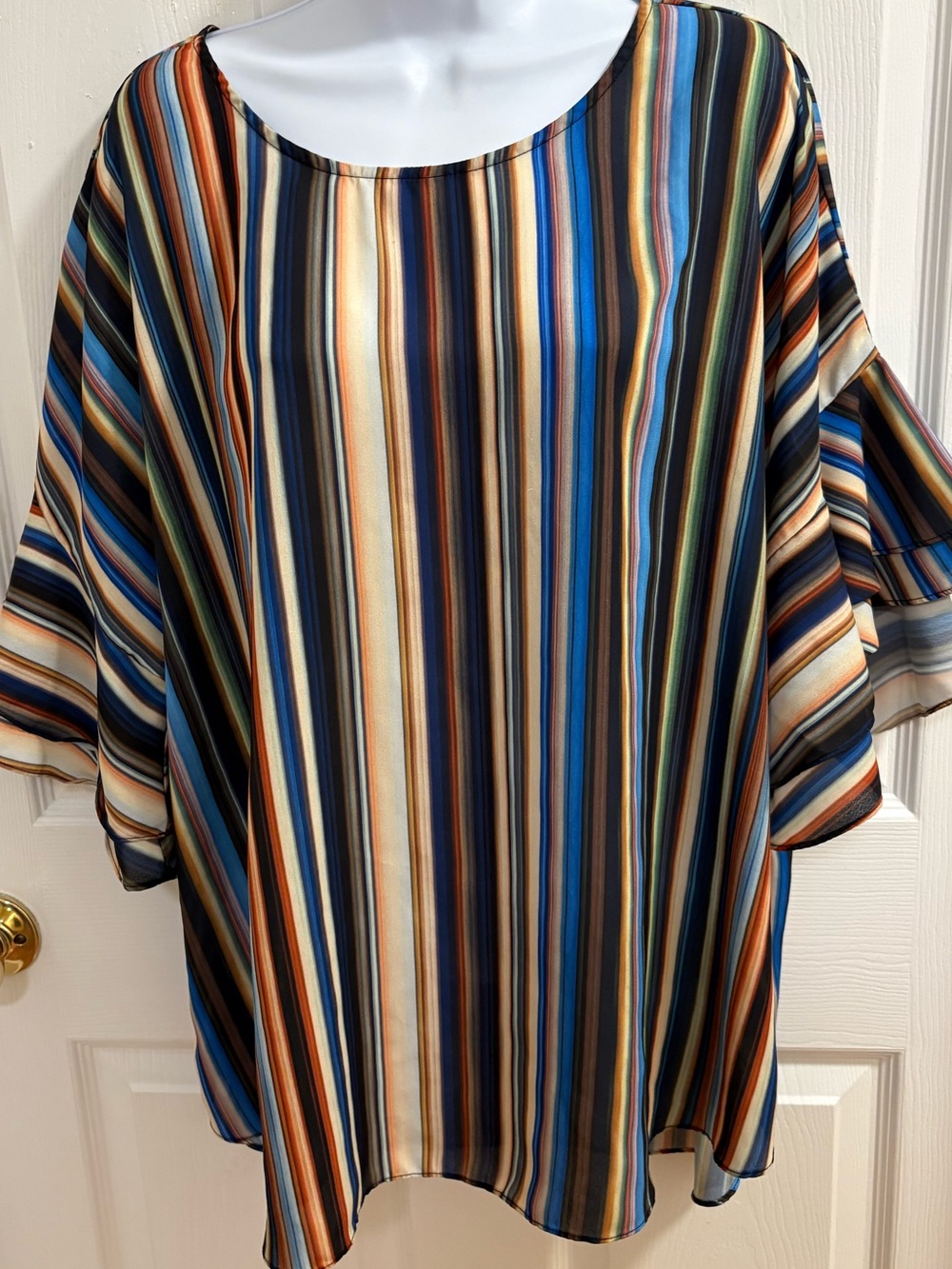 C est 1946, short-sleeved women's blouse featuring multicolored vertical stripe